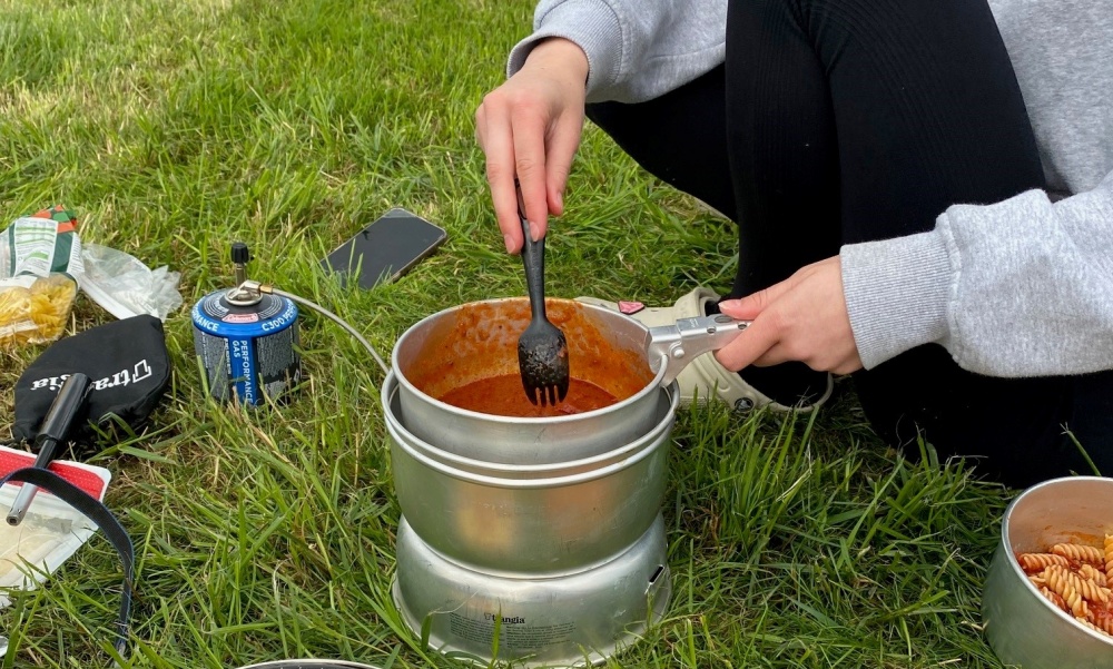 Students cooking over a trangia